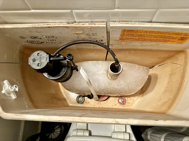Broken toilet tank illustrating common habitability violations in Chicago rental apartments